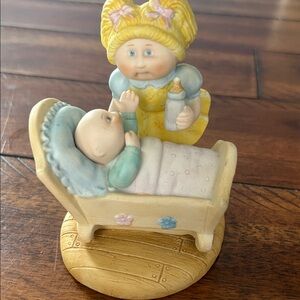 Vintage Cabbage Patch Kids Ceramic Figurine with Yellow and Blue Accents